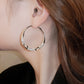 Boucles d'oreilles circulaires avec zircon