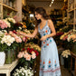 👗 50% DE RÉDUCTION 🌸 Robe sans manches col V imprimé floral – Silhouette fluide & fente latérale – Style bohème, légère & parfaite pour les journées chaudes, les vacances ou les mariages en extérieur 🌼