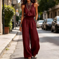 👗 50% DE RÉDUCTION 🌸 Combinaison élégante à dos nu & col licou – Tissu fluide & coupe chic – Parfaite pour les soirées, les mariages ou les vacances – confortable et féminine ✨💃🌿